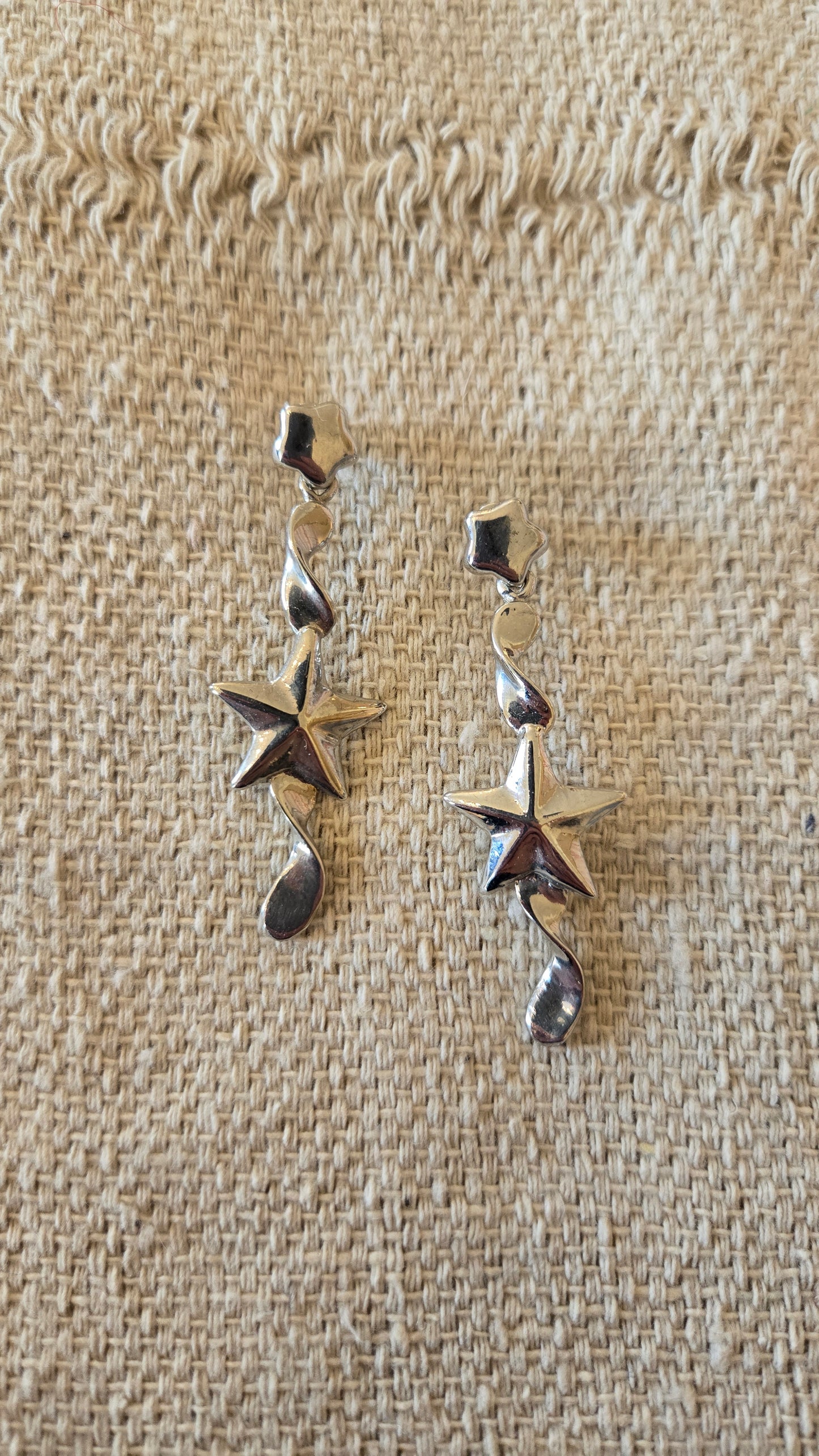 Silver star drop earrings