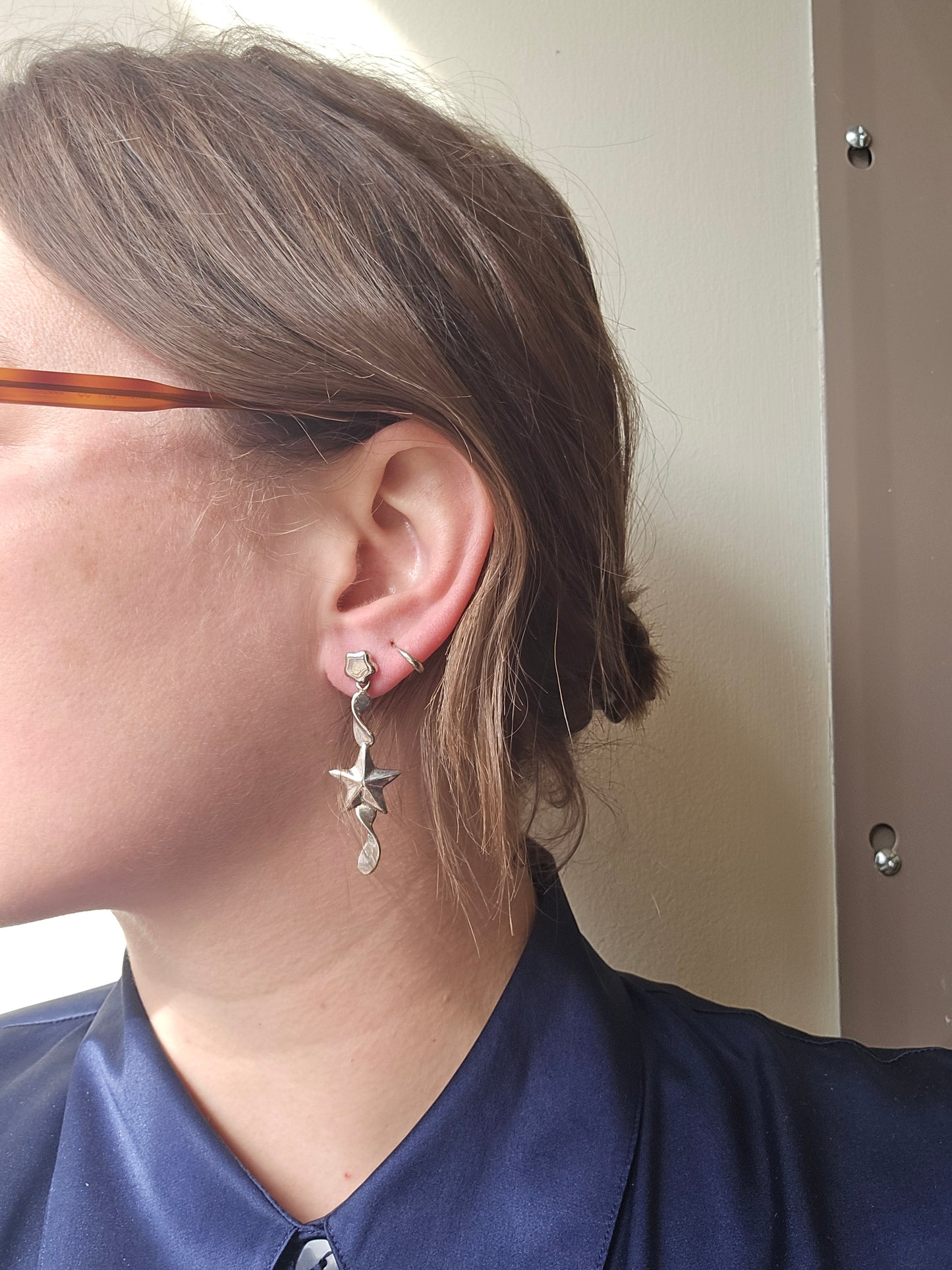 Silver star drop earrings