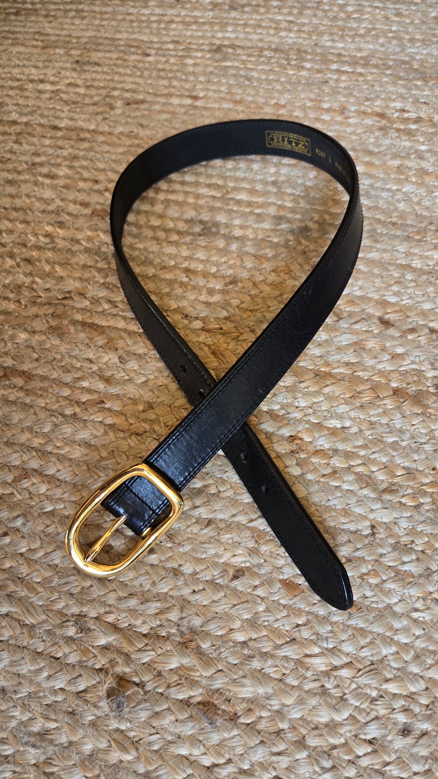 Black leather belt with heavy gold rounded square buckle