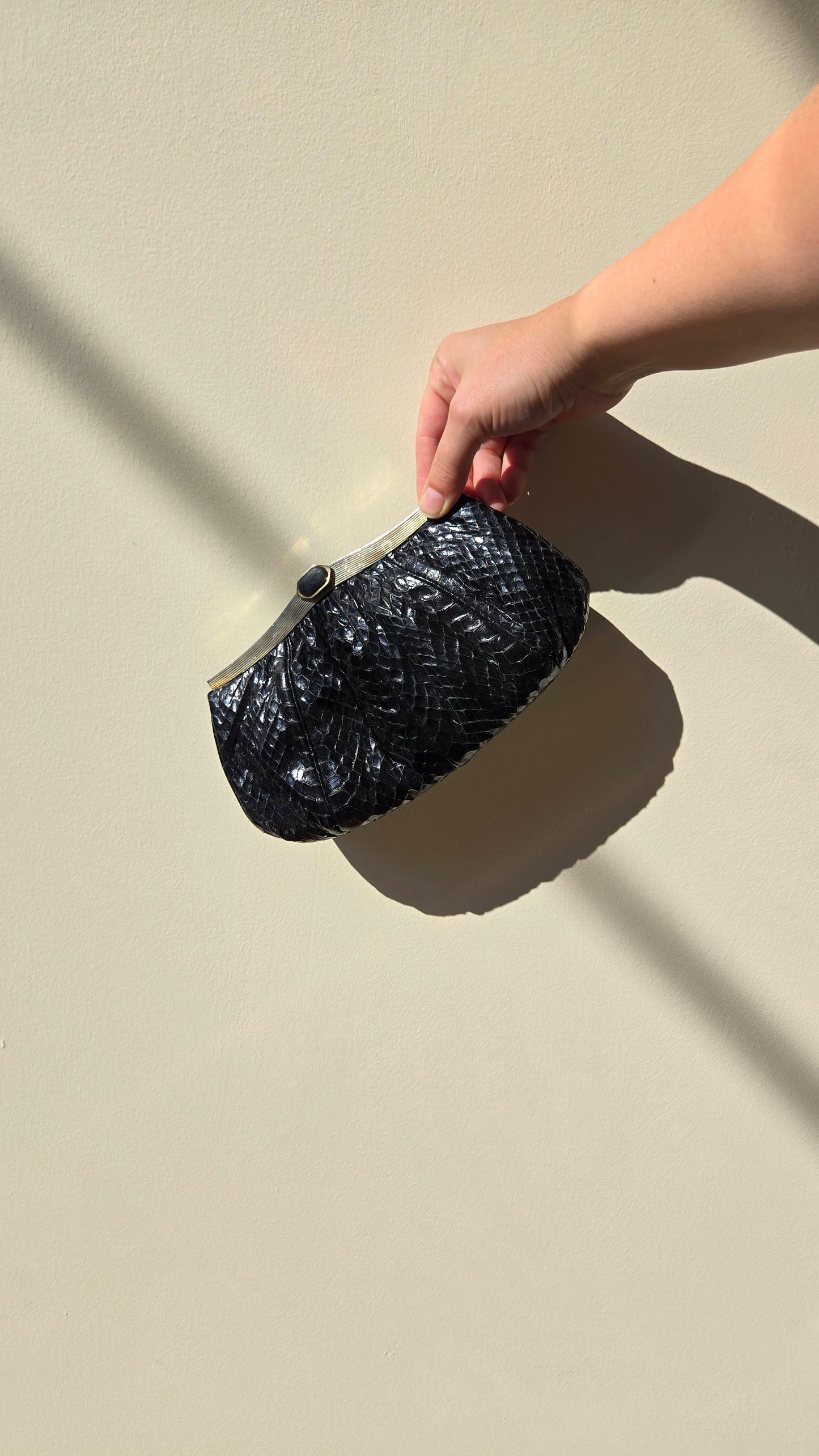 Judith Leiber black snake clutch
