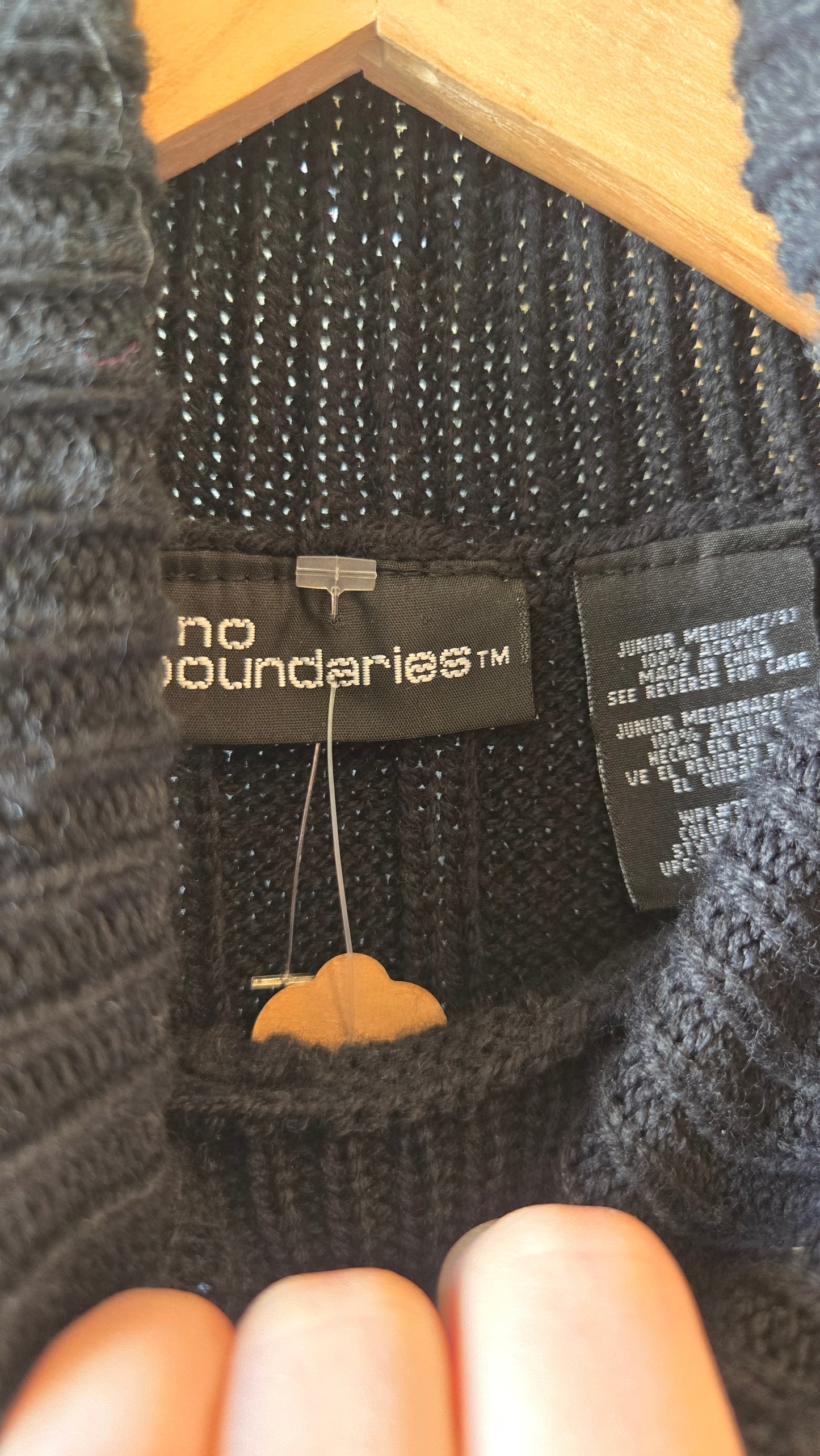 Black sleeveless chunky turtleneck