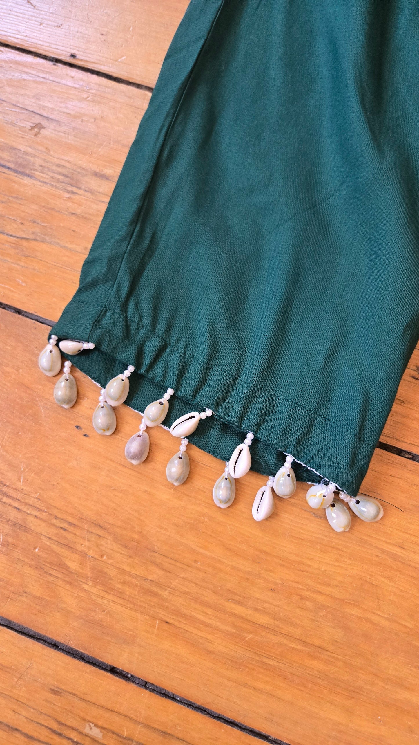 Green puka shell-trimmed pants!