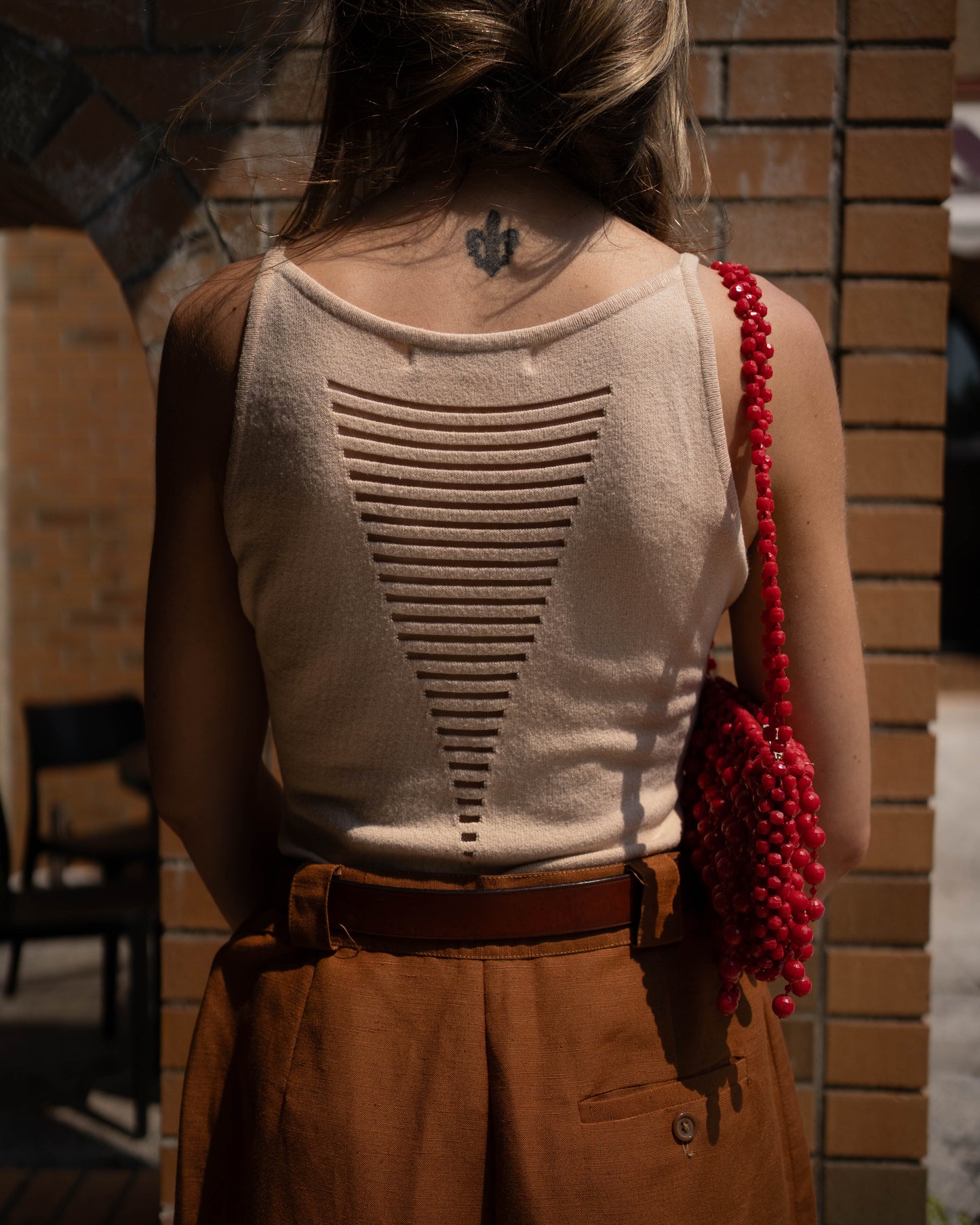 Beige knit tank with sheer strips