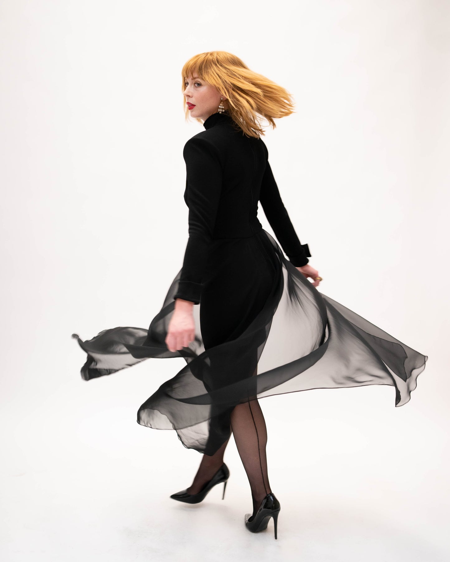 Dana Deatheridge black bodycon mini with sheer train!