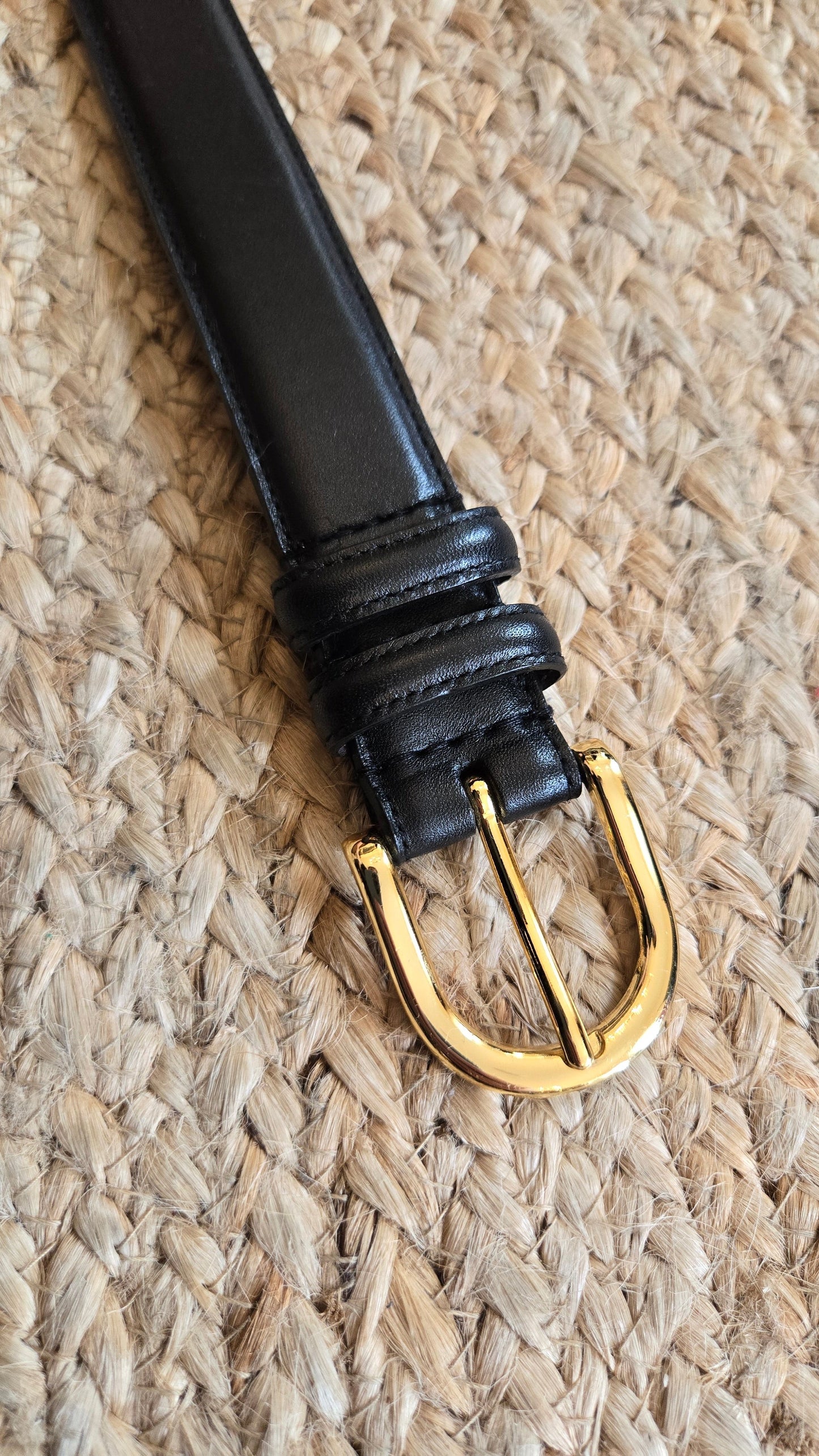 Black leather belt with gold buckle