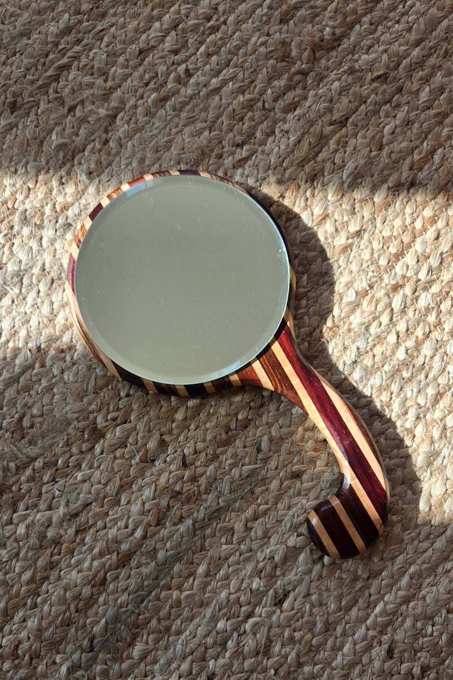 Striped wooden hand mirror