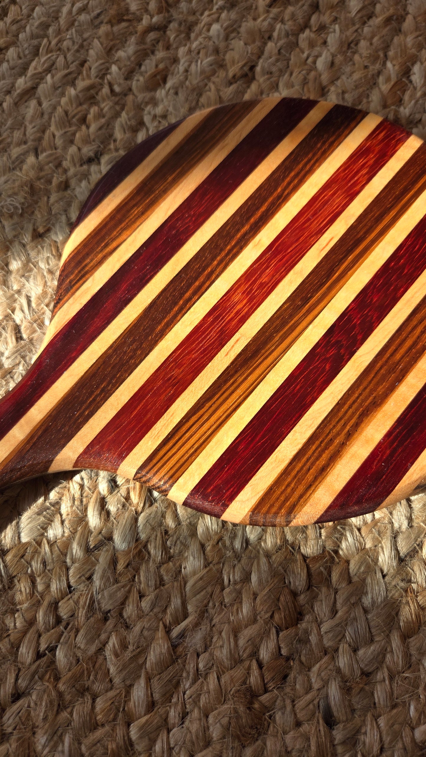 Striped wooden hand mirror