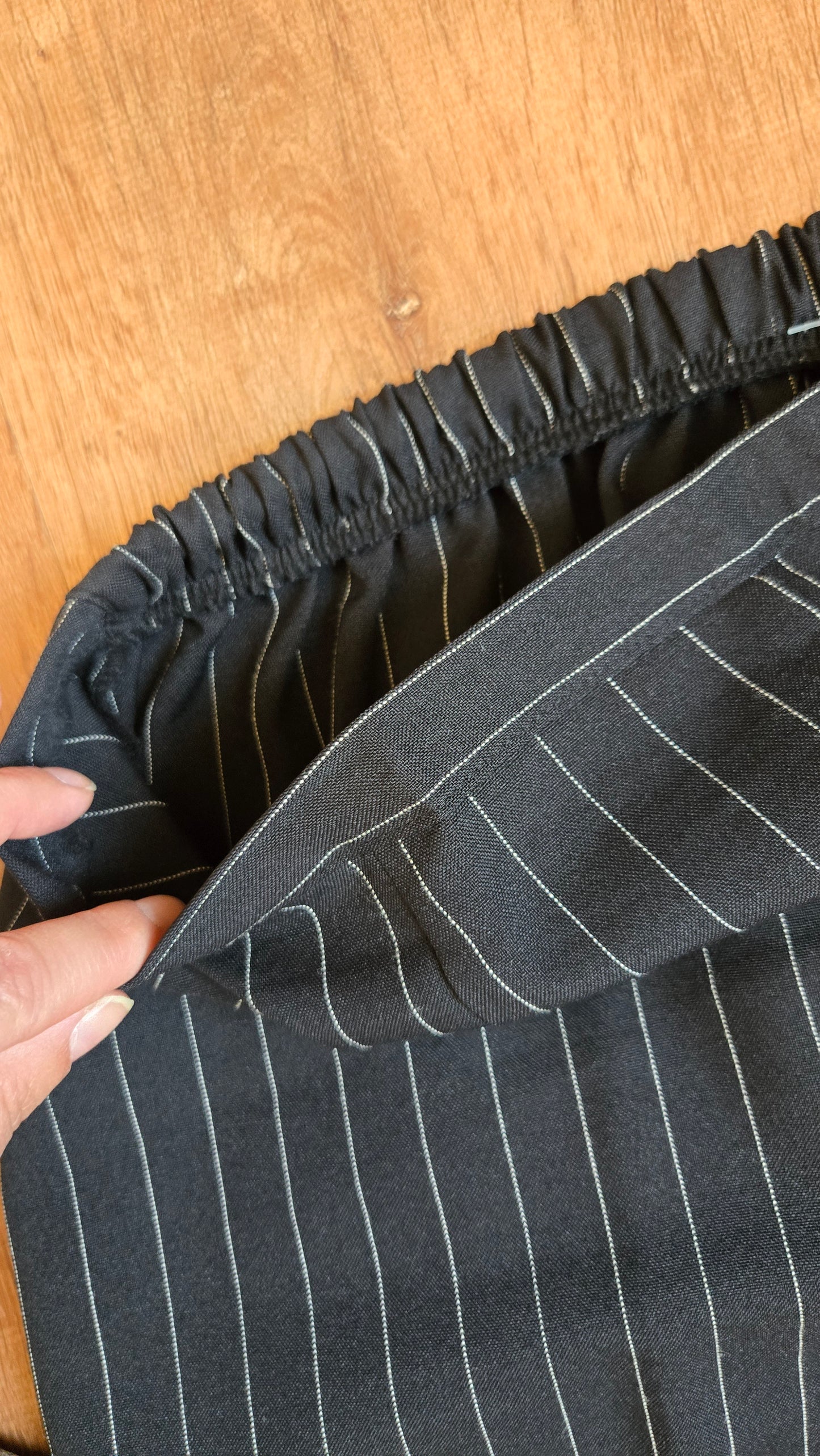Black pinstripe pants