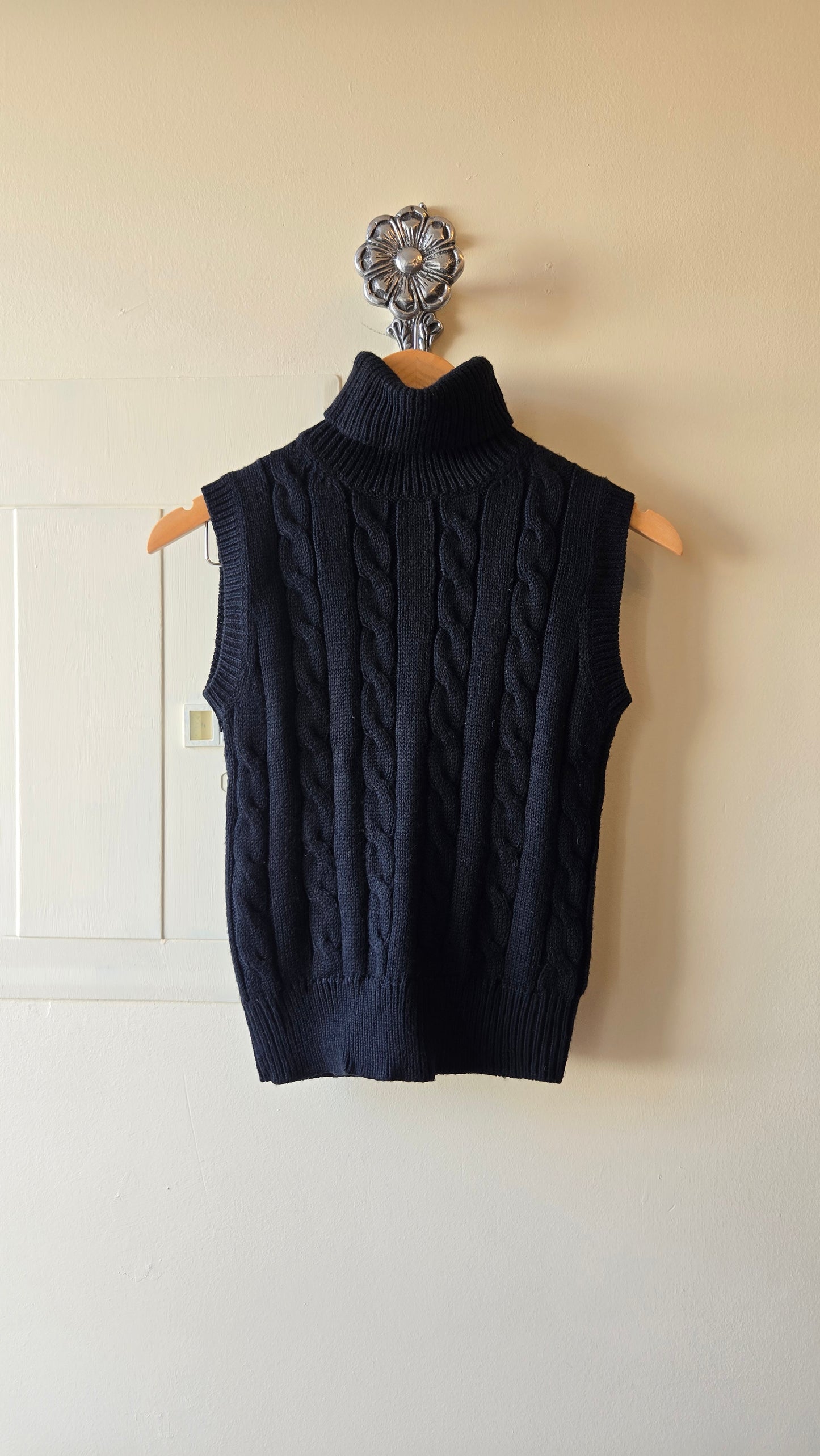 Black sleeveless chunky turtleneck