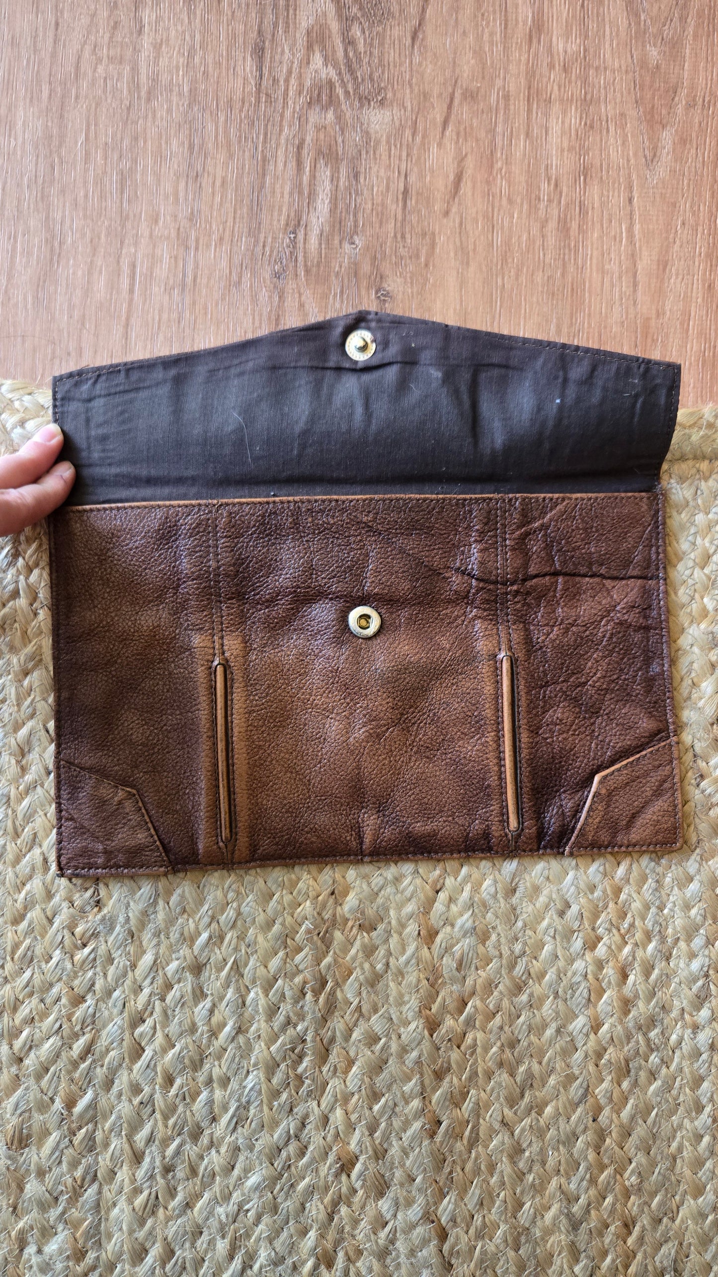 Brown leather envelope clutch