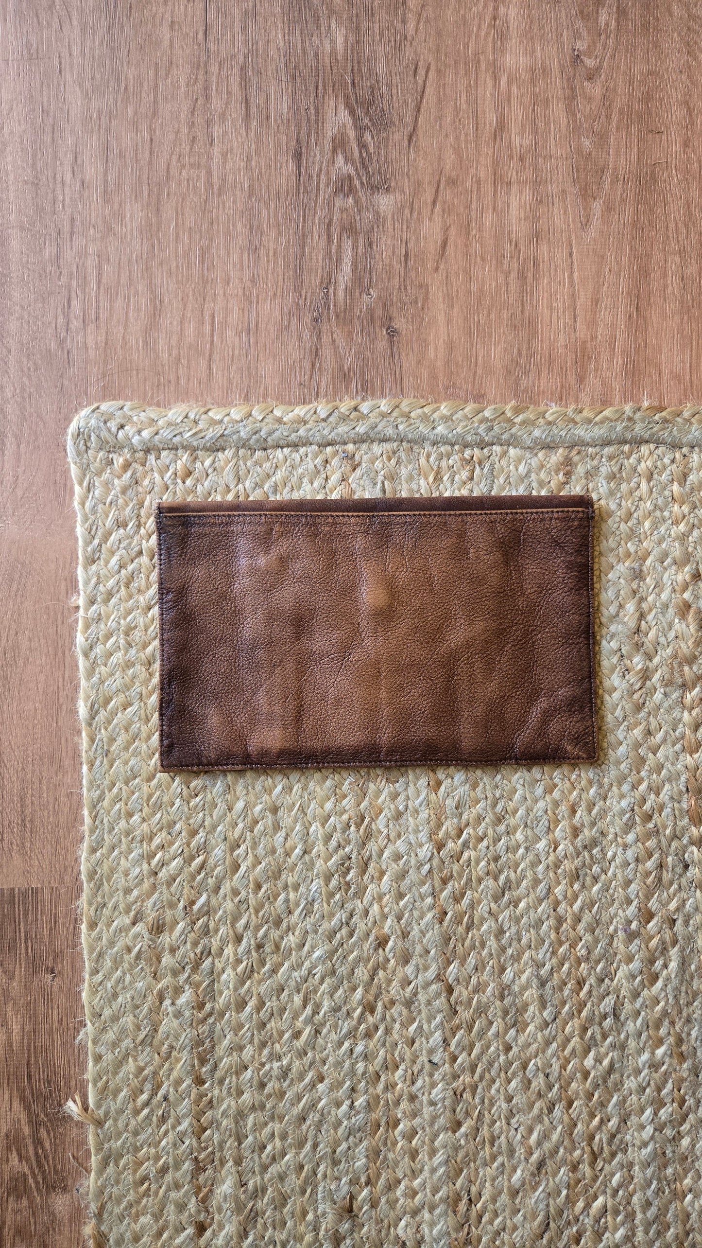 Brown leather envelope clutch