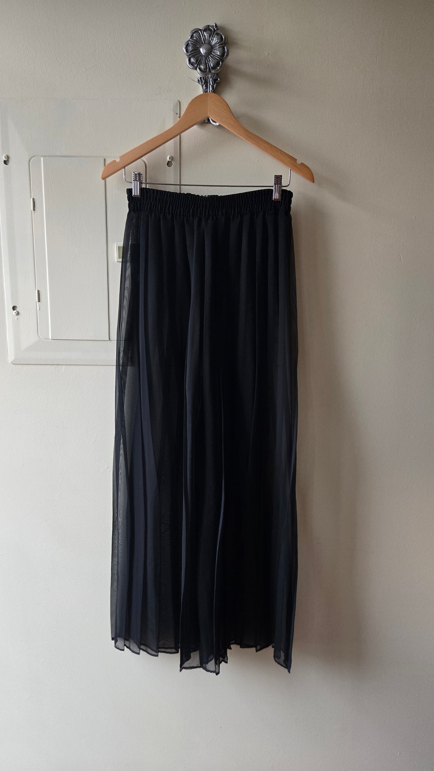 Sheer black pleated palazzo pants