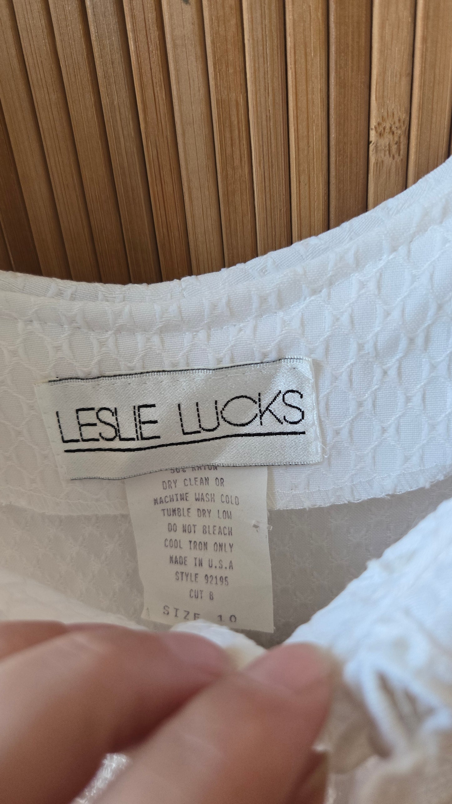 Leslie Lucks white collar dress!