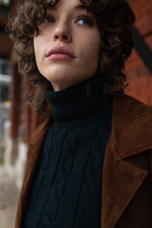 Black sleeveless chunky turtleneck